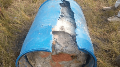 woman's body in plastic drum