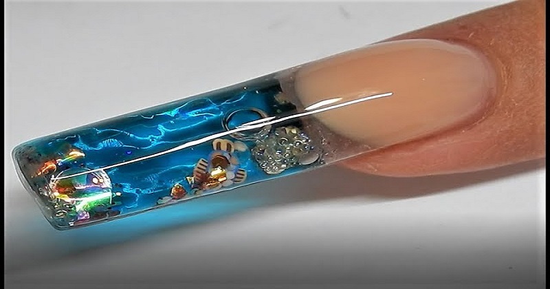 A new nail art called 'aquarium manicure' sparks outrage online. Watch the  video | DH Latest News, DH NEWS, Latest News, Beauty, NEWS, Beauty ,  aquarium manicure, Nail Art